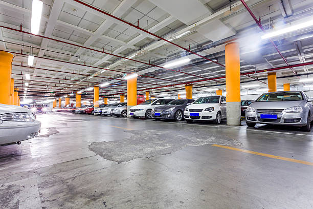 istock Parking garage, underground interior with a few parked cars 497298455