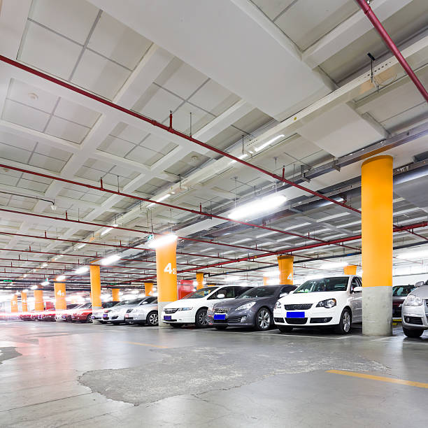istock Parking garage, underground interior with a few parked cars 497298469