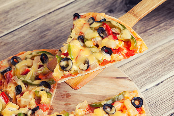 istock Delicious italian pizza served on wooden table 497299981
