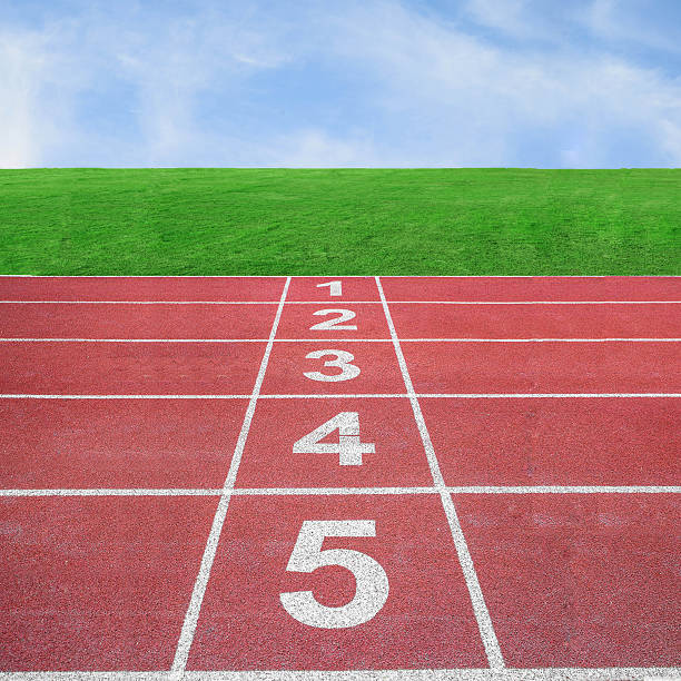 istock Start or finish position on running track with blue sky 497300399