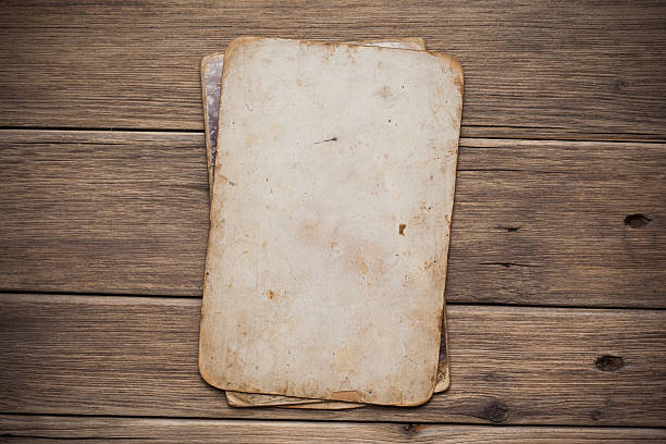 istock Old paper on the wood background 497301157