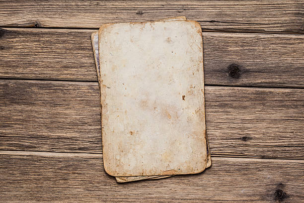 istock Old paper on the wood background 497301191