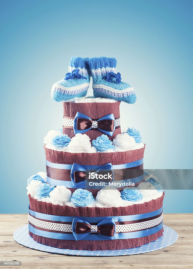 cake made from diapers standing on wooden table Baby - Human Age Stock Photo