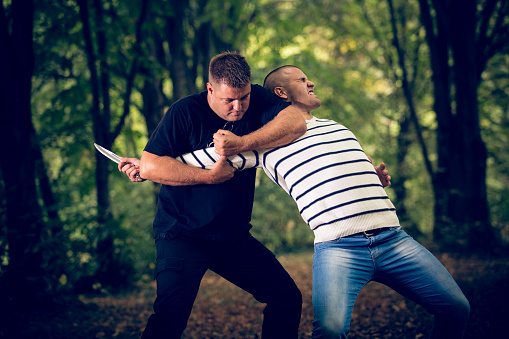 Two men practicing self-defense