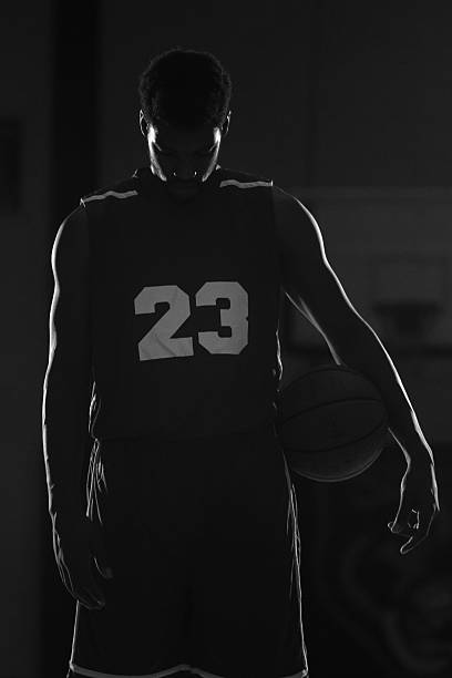 istock Young men playing basketball in a gymnasium 497309764