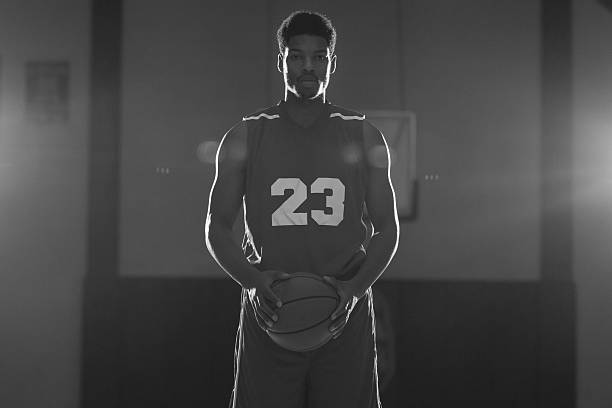 istock Young men playing basketball in a gymnasium 497309804