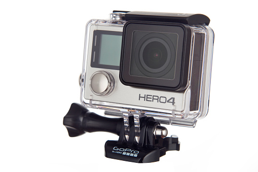 Zgierz, Poland - October 11, 2015: A GoPro HERO 4 Black edition photographed on a white background. In September 2014 GoPro announced the HERO4 camera, available in Black Edition and Silver Edition, which replace their respective Hero3+ generation cameras.