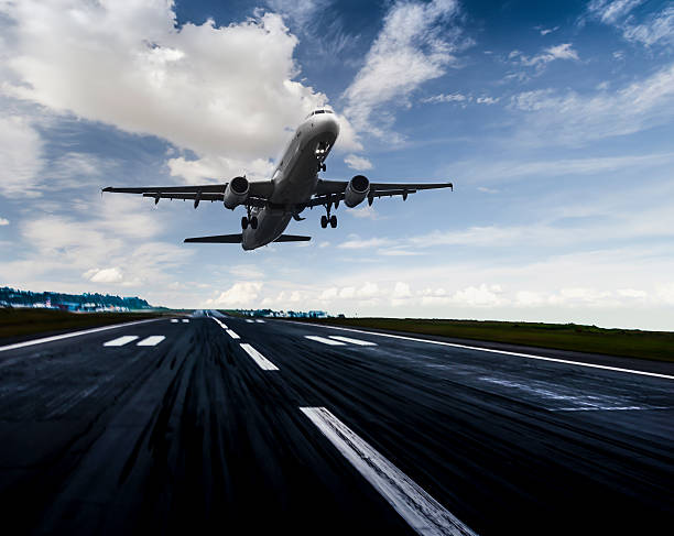istock Passenger airplane landing at dusk 497311926
