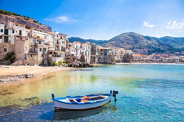 old harbor with wooden fishing boat in cefalu, sicily - sicilië stockfoto's en -beelden
