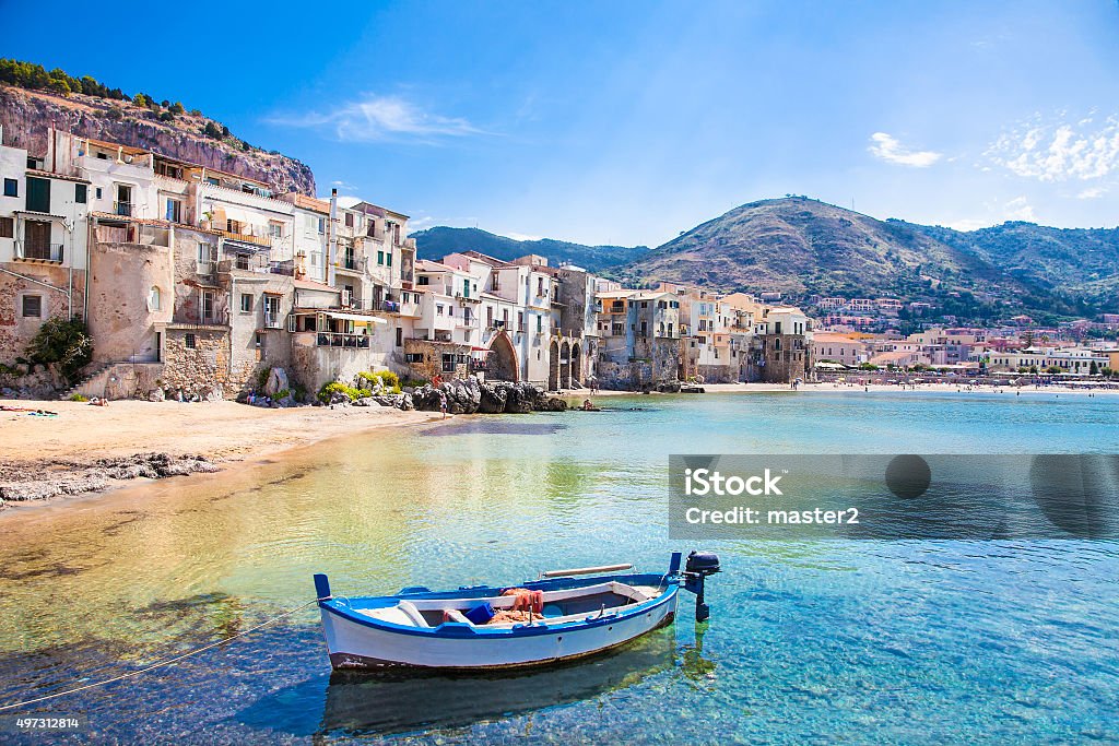 Old harbor with wooden fishing boat in Cefalu, Sicily Beautiful old harbor with wooden fishing boat in Cefalu, Sicily, Italy. Sicily Stock Photo