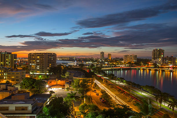 Stunning sunset in San Juan, Puerto Rico Vast and expansive view of the San Juan Bay, Condado Lagoon and the city of San Juan, Puerto Rico at sunset.   san juan stock pictures, royalty-free photos & images