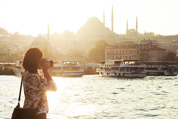 Pretty woman taking pictures in Istanbul,Turkey Galata and Eminönü district in Istanbul,Turkey muslim photographer stock pictures, royalty-free photos & images