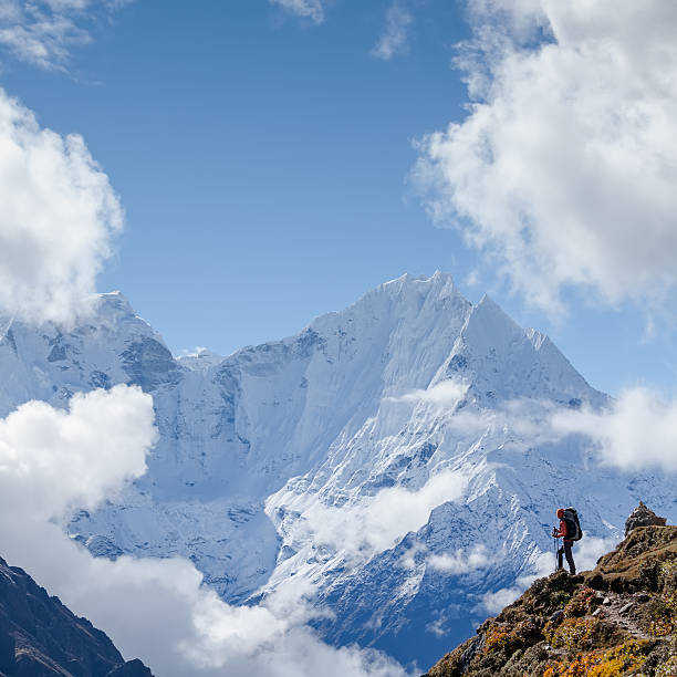 istock Hiker walks on train in Himalayas 497317642