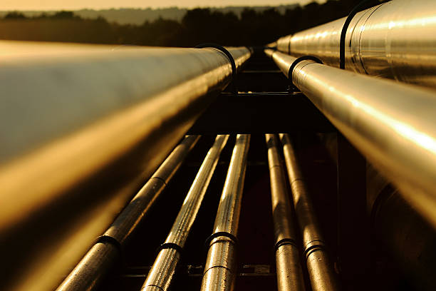 Close up view of steel golden pipes in refinery stock photo