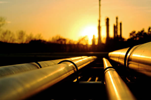 istock Golden pipes going to oil refinery 497318682