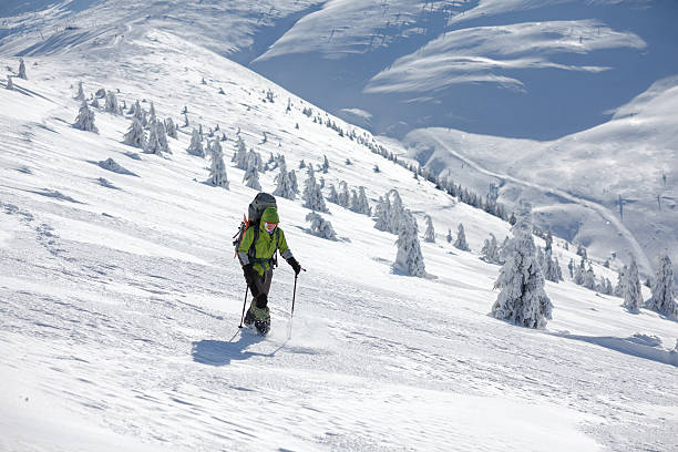 istock Hiker walking in winter Carpathian mountains 497319326