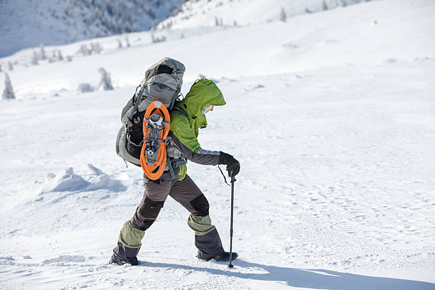 istock Hiker walking in winter Carpathian mountains 497319350
