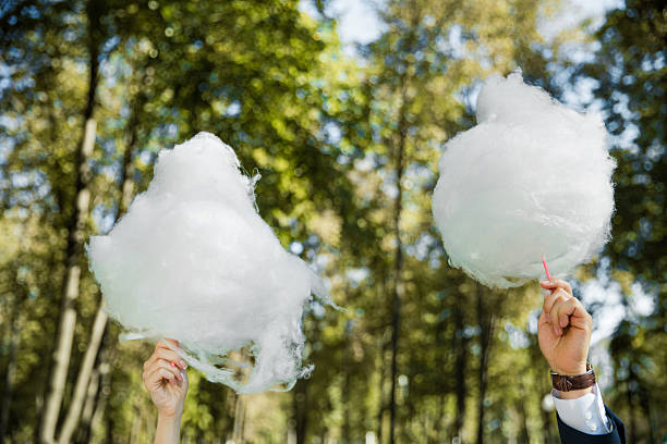 istock couple holding cotton candy 497320274
