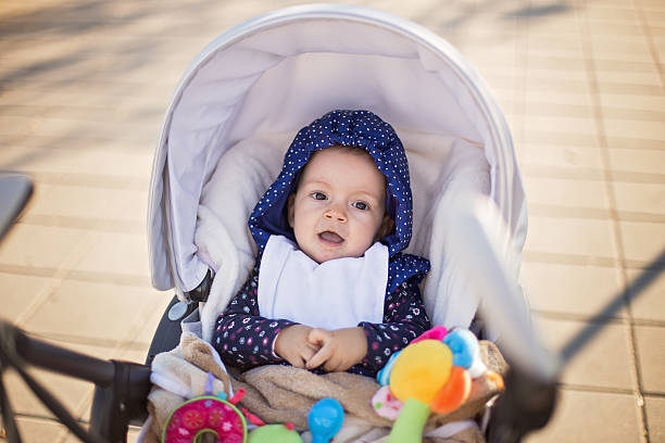 istock Laughing baby in a carriage 497321788