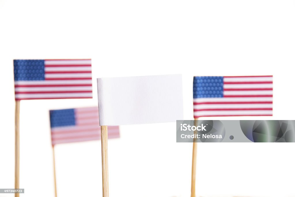 American Flags and a White Flag Some American Flags and a White Flag with Copyspace, Isolated American Flag Stock Photo