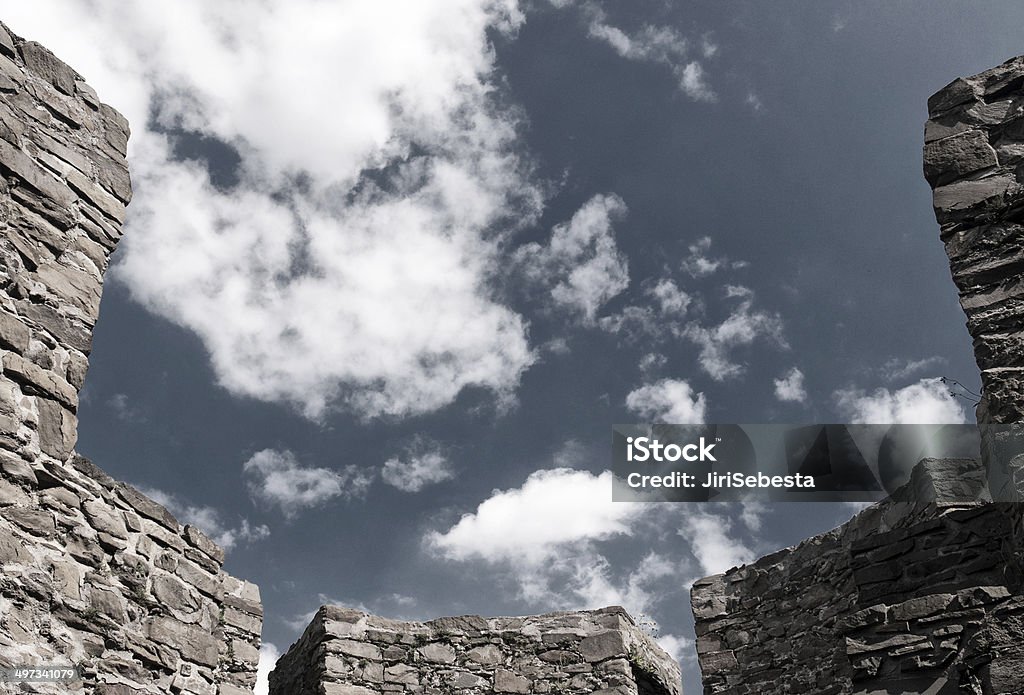 Stone walls of old castle Sky over stone walls of old castle Ancient Stock Photo