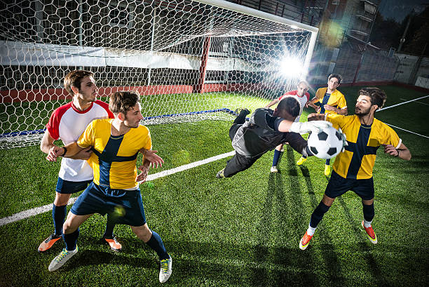 istock Football match in stadium: Goalkeeper save 497341515