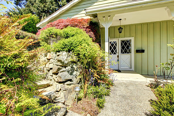 istock Entrance porch with landscaped front yard 497341789