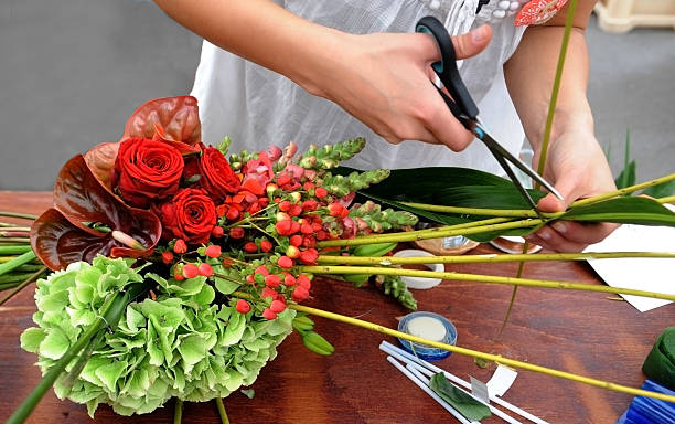 istock Florist makes flowers bouquet 497341853