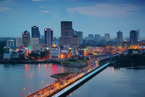 The Malaysian city of Johor Bahru, with heavy traffic on the Johor-Singapore Causeway at dusk.