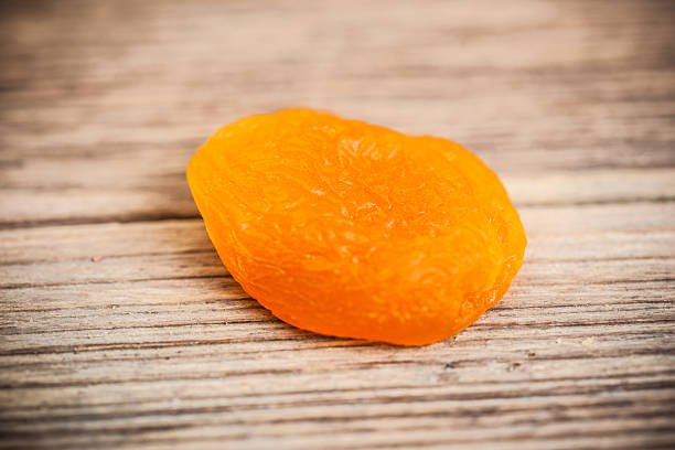 istock Heap of dried apricots close-up 497342823