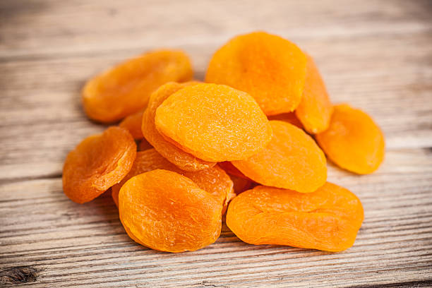 istock Heap of dried apricots close-up 497342825