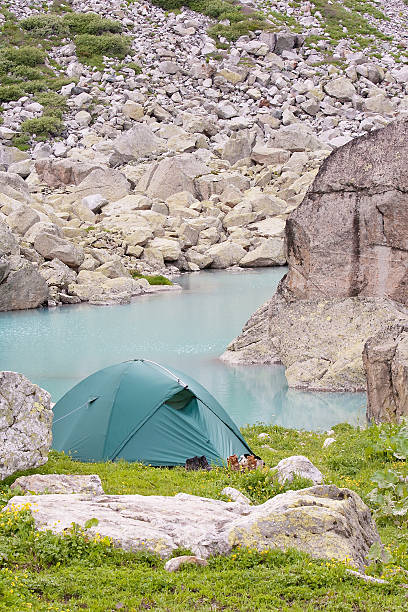 istock Green tent in the mountains 497343334