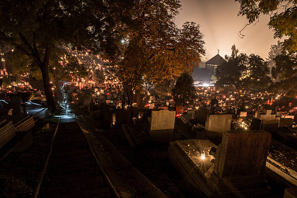 istock cemetery at night in candlelight 497344140