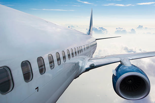 istock Body of an Airplane Flying Above Cloud 497344980