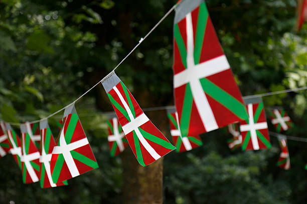 istock Basque country flags flying in a park with trees. 497345800