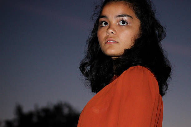 istock Hispanic Female Teenager With Serious Expression Poses For Camera 497347904