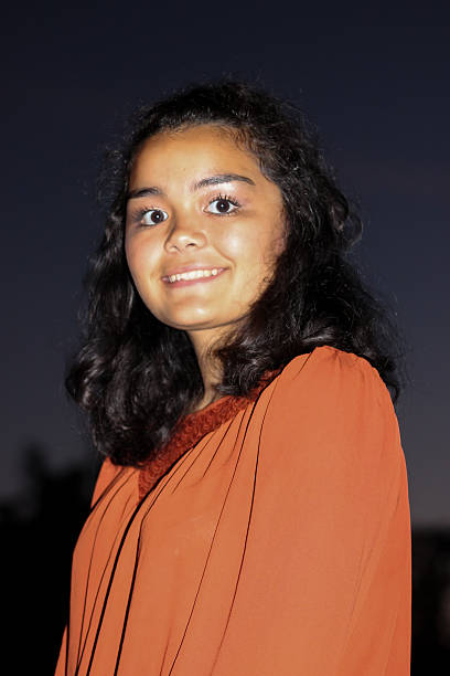 istock Hispanic Teenager Smiles For Camera 497347926