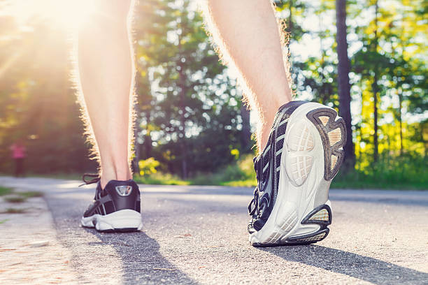 istock Athlete young male jogging outside 497348140
