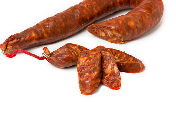 istock tasty sausage sliced  on isolated background 497348158