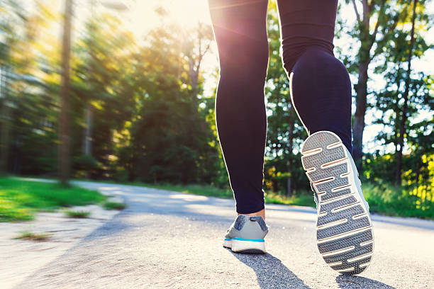 istock Woman in jogging shoes ready for a run outside 497348178