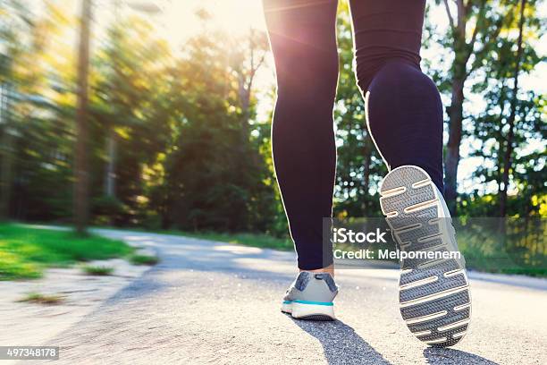Woman In Jogging Shoes Ready For A Run Outside Stock Photo - Download Image Now - 2015, Active Lifestyle, Activity