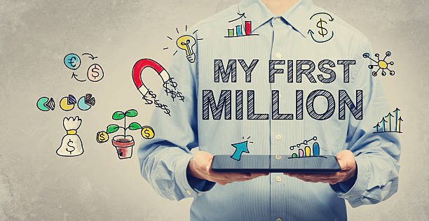 istock My First Million concept with young man holding a tablet 497348448