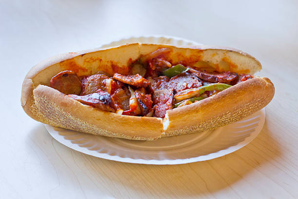 Sausage Onion Pepper Sandwich Fried sausage onions and red and green bell peppers on sandwich bun torpedo sandwich stock pictures, royalty-free photos & images