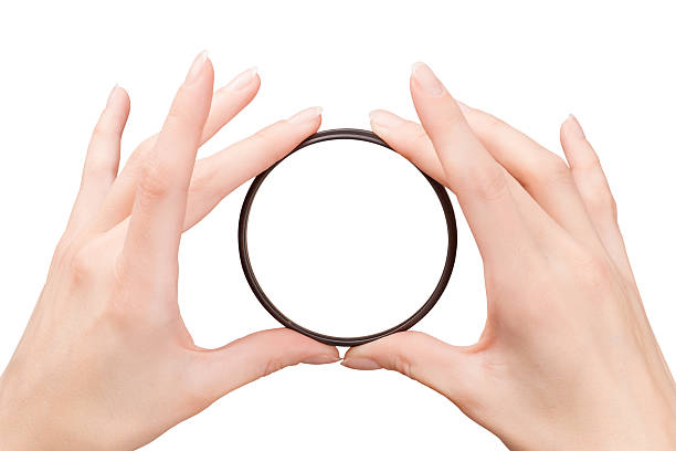 istock Beautiful woman hands holding the camera filter 497349986