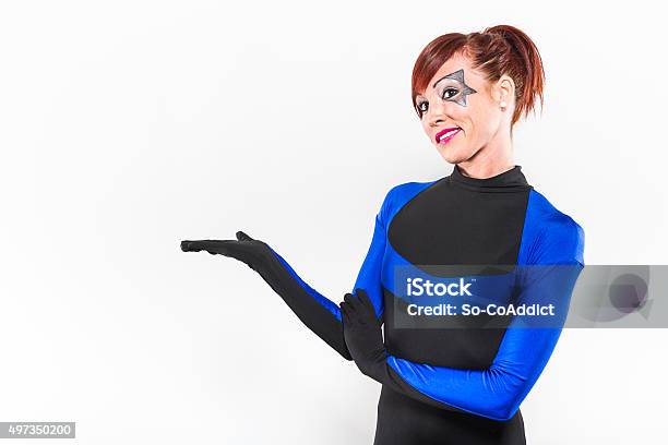 Redhead Woman Presenting In Costume Stock Photo - Download Image Now - 20-24 Years, 20-29 Years, 2015
