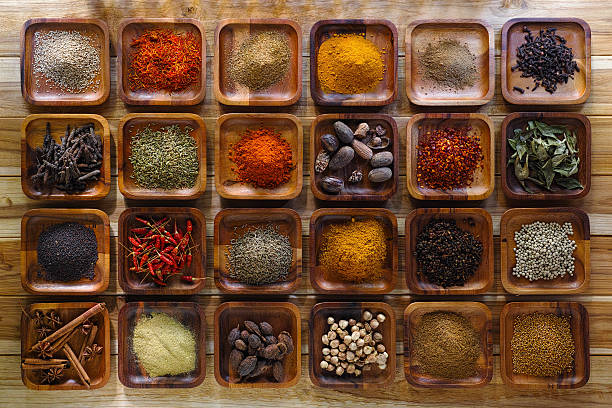 istock Indian spices in wooden trays. 497352180