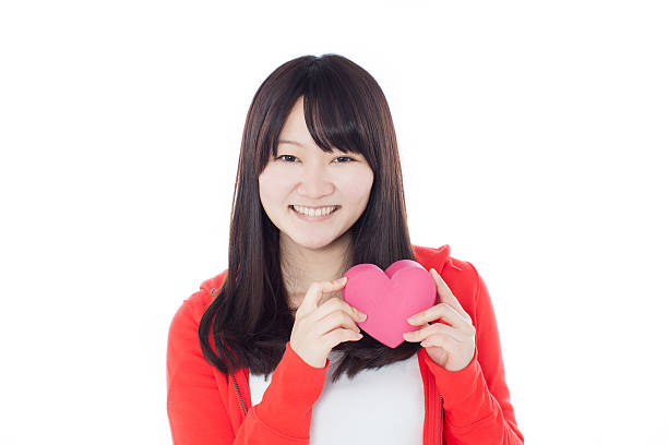 istock girl with pink heart 497353876