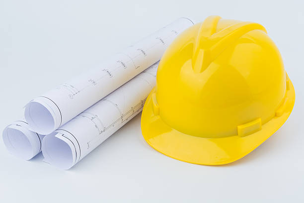 istock Yellow safety helmet and paper 497354580