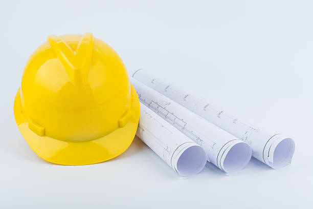 istock Yellow safety helmet and paper 497354616