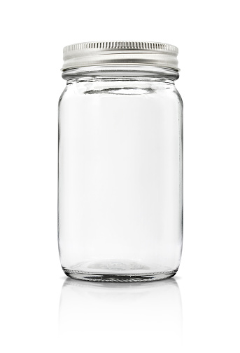 Clear glass bottle with silver cap isolated on white background with clipping path